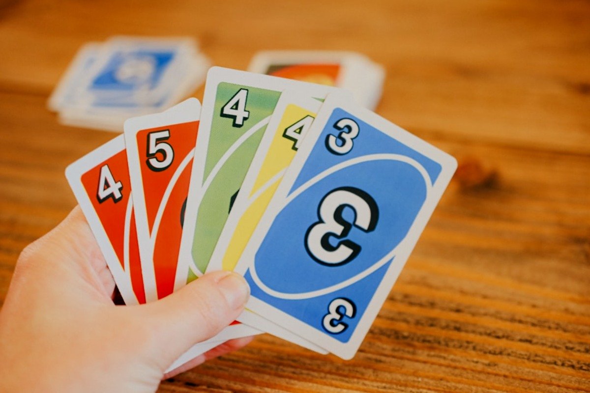 The UNO Out is a house rule that allows players to leave the game while holding all their cards. Players do not need to say "UNO Out" when playing their final card, instead, they yell UNO while playing their second last card.