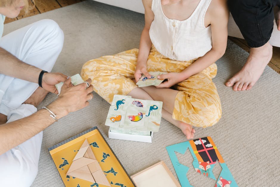 A family enjoying educational puzzles and card games together on a cozy carpet.